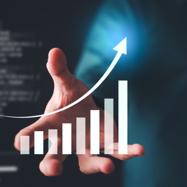 A hand reaching out with a graphic overlay of a rising bar graph and an upward arrow, symbolizing growth and success.