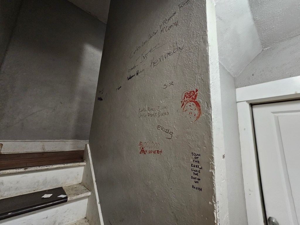 an old apartment interior covered in graffiti