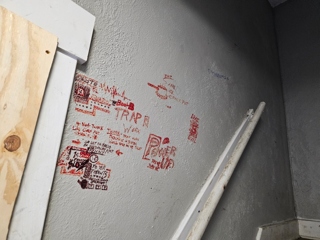 an old apartment interior covered in graffiti