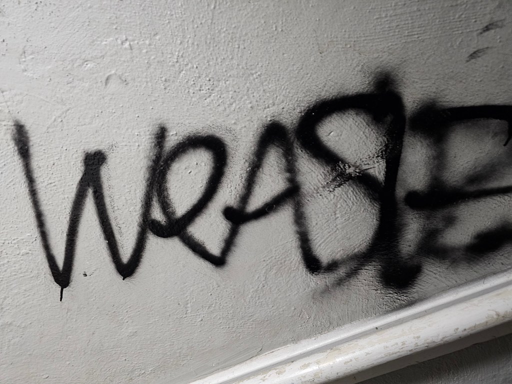 an old apartment interior covered in graffiti
