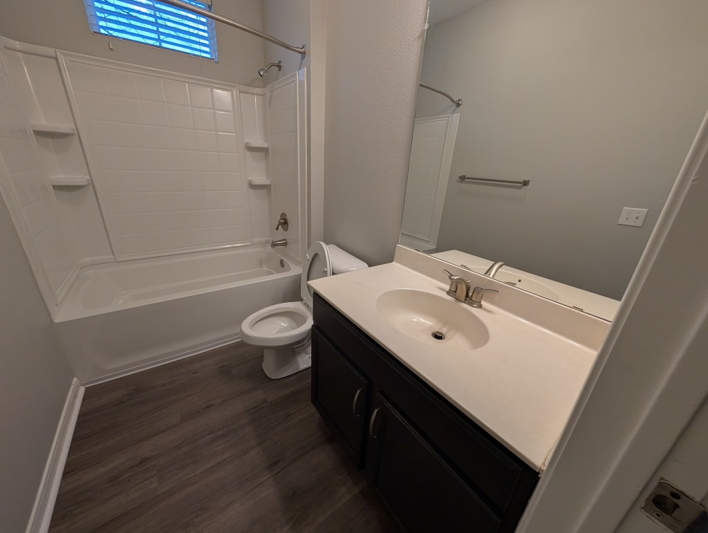 a brand new modern apartment bathroom