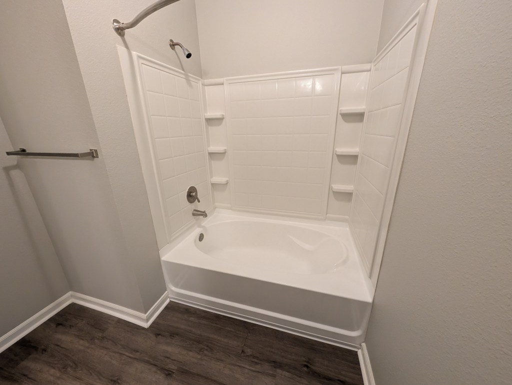 a brand new modern apartment bathroom