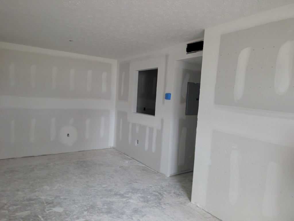 an apartment interior with new drywall